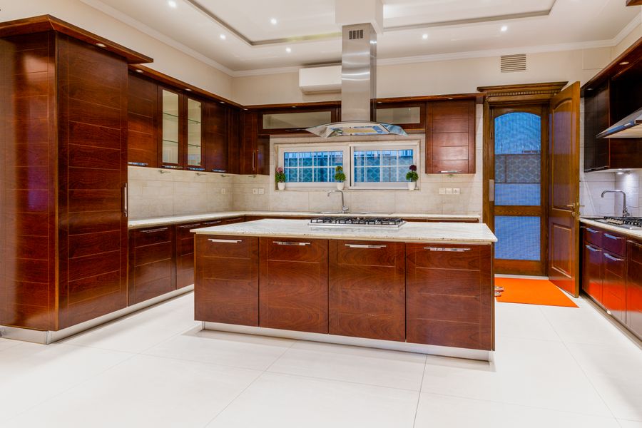 Chef's kitchen with custom island and cabinetry in Osprey